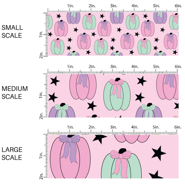 This scale chart of small scale, medium scale, and large scale of these Halloween themed pattern fabric by the yard features the following design elements: colorful pumpkins on light pink. This fun spooky themed fabric can be used for all your sewing and crafting needs!