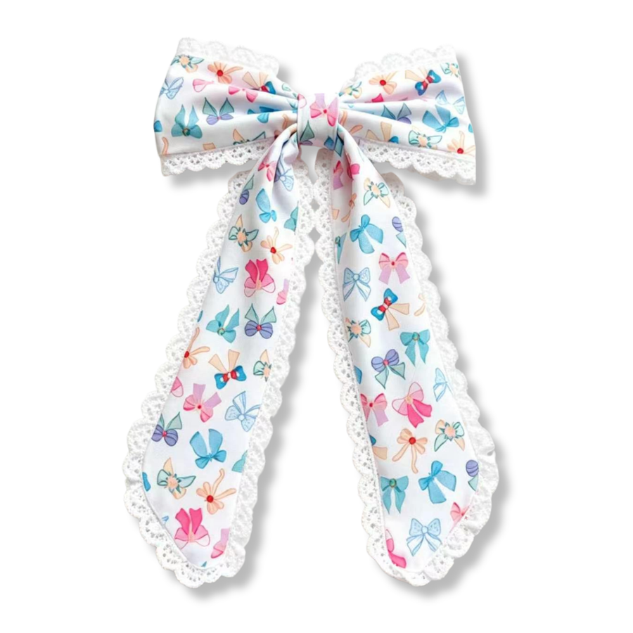 This elegant bow features a white ribbon printed with colorful bow motifs in shades of blue, pink, purple, and peach. Delicate white lace trim frames the bow and long tails, adding a soft, vintage-inspired touch. Perfect for adding charm and sweetness to any outfit.
Large 5.5" X 9.5"