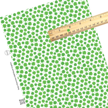 These St. Patrick's Day pattern themed faux leather sheets contain the following design elements: green shamrocks on white. Our CPSIA compliant faux leather sheets or rolls can be used for all types of crafting projects.