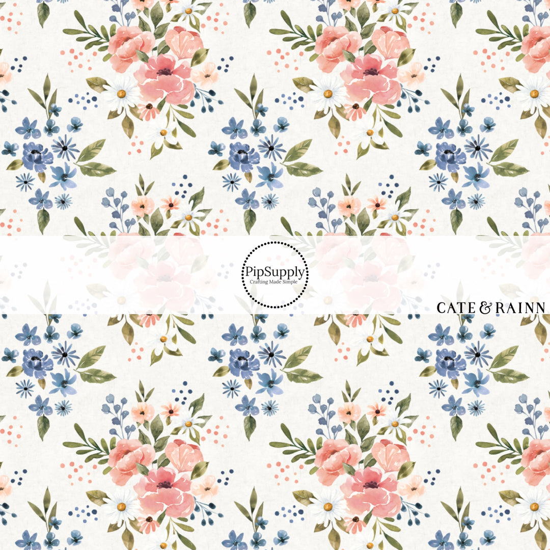 These flower pattern themed fabric by the yard features pink and blue flower bunches on ivory. This fun floral fabric can be used for all your sewing and crafting needs!