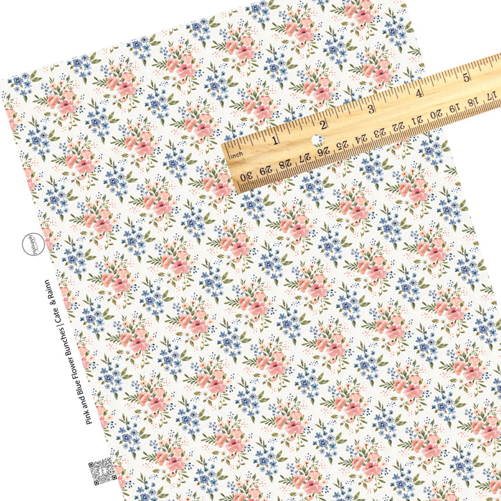 These flower themed faux leather sheets contain the following design elements: pink and blue flower bunches on ivory. Our CPSIA compliant faux leather sheets or rolls can be used for all types of crafting projects.