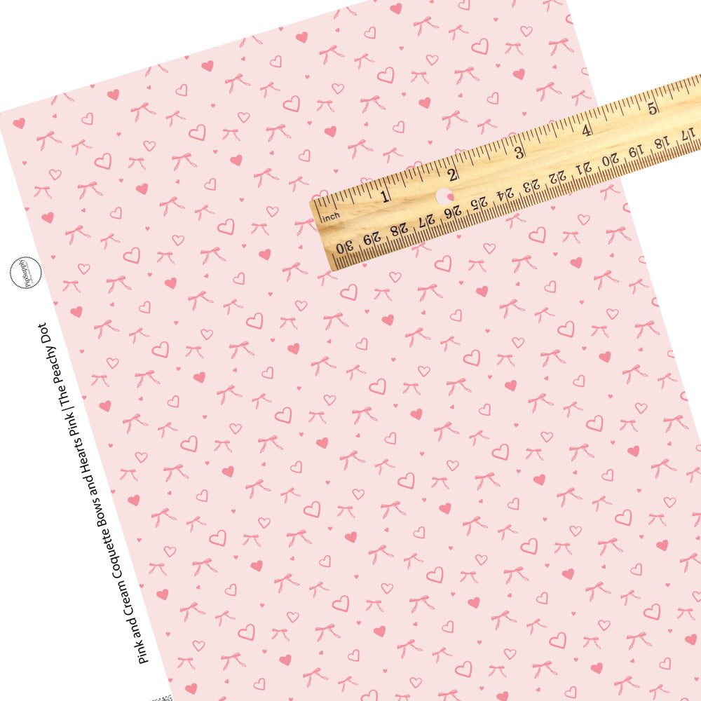 These Valentine's pattern themed faux leather sheets contain the following design elements: pink hearts and bows on light pink. Our CPSIA compliant faux leather sheets or rolls can be used for all types of crafting projects.