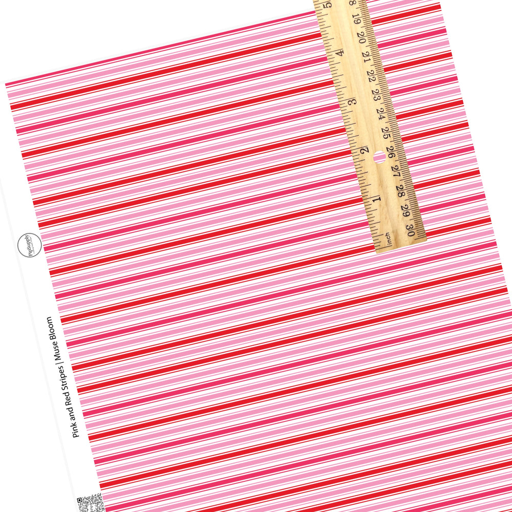 These Valentine's pattern themed faux leather sheets contain the following design elements: rows of red and pink strips on white. Our CPSIA compliant faux leather sheets or rolls can be used for all types of crafting projects.