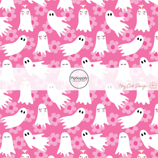 These Halloween themed pink fabric by the yard features white ghosts surrounded by light pink daisies on pink. This fun spooky themed fabric can be used for all your sewing and crafting needs! 