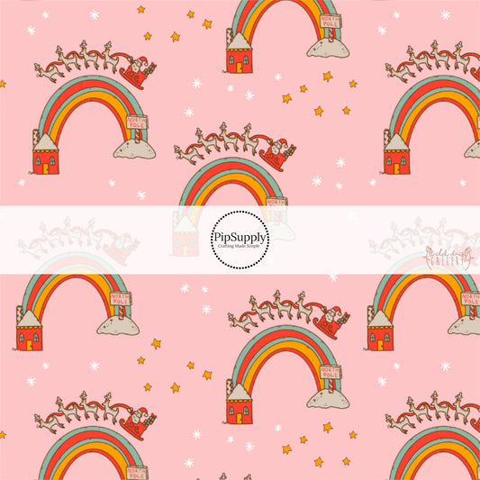 Pink fabric by the yard with rainbows and reindeer.