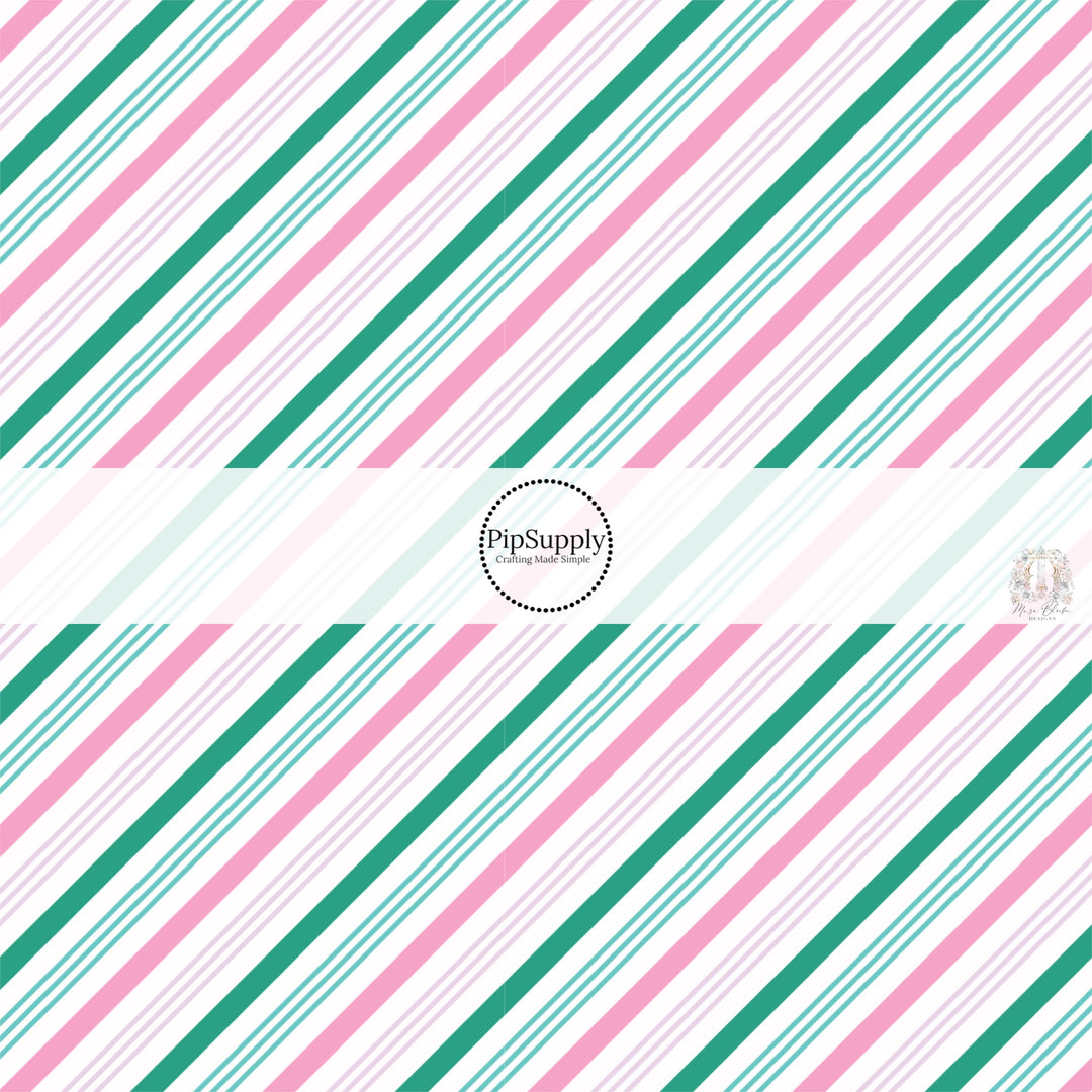 White fabric by the yard with green and pink diagonal stripes.