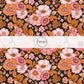 Black fabric by the yard with orange and pink florals.