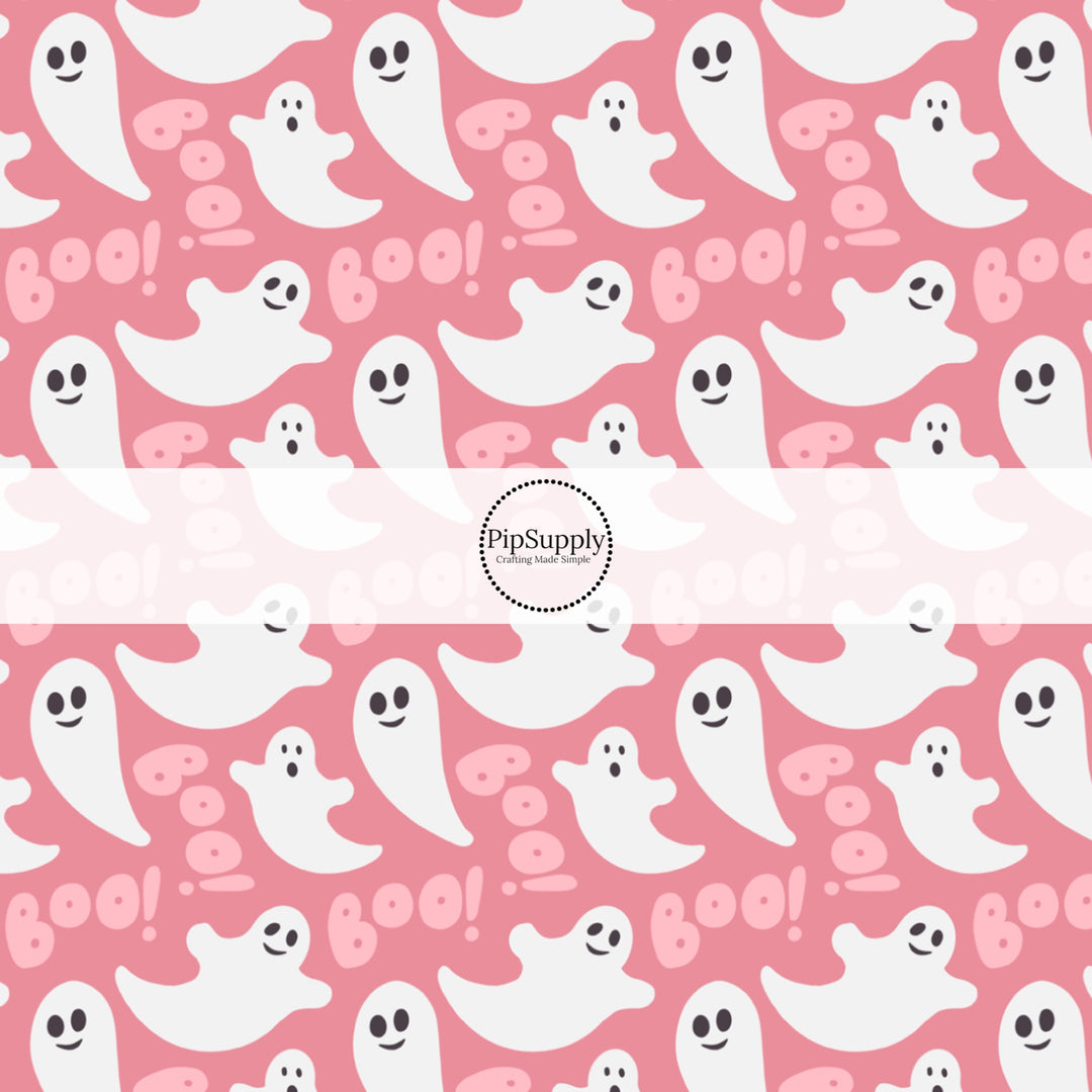 Bubblegum pink fabric by the yard with white ghosts and the phrase "Boo!"