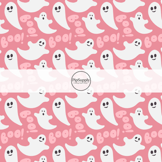 Bubblegum pink fabric by the yard with white ghosts and the phrase "Boo!"