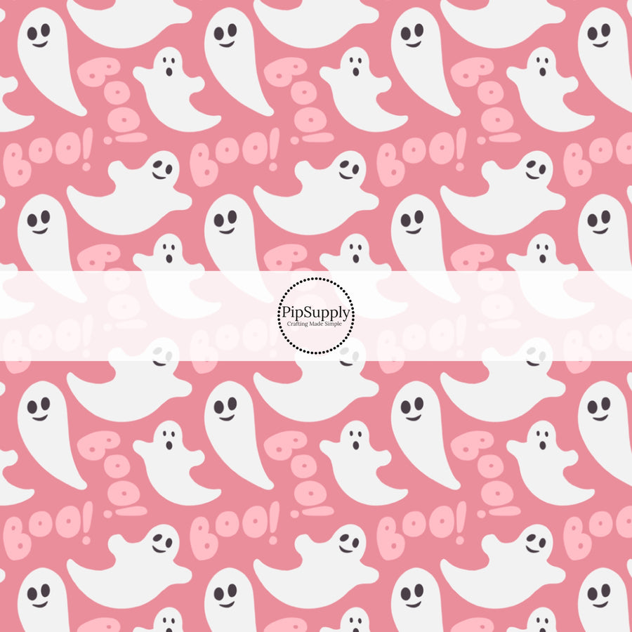 Bubblegum pink fabric by the yard with white ghosts and the phrase "Boo!"