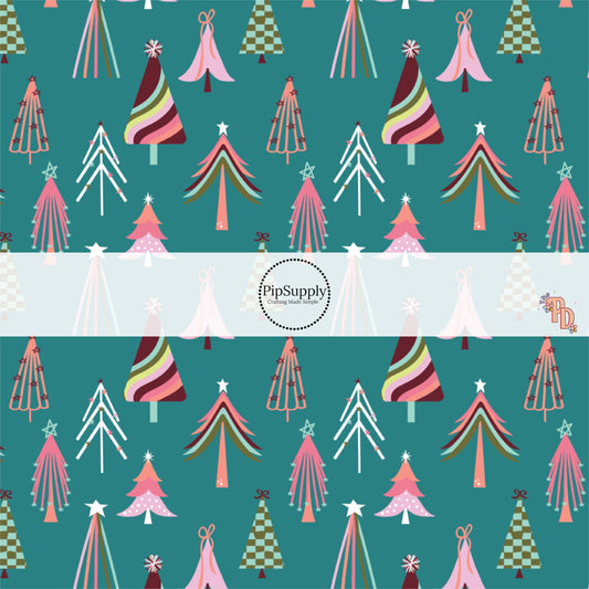 Multi-colored Christmas trees on turquoise blue fabric by the yard.