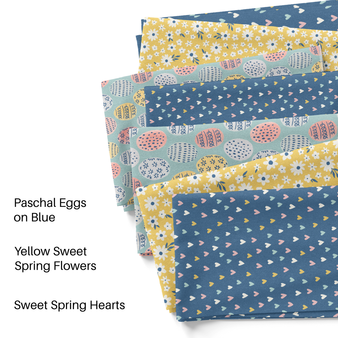 Point and poem blue and yellow hearts, florals, and eggs fabric by the yard swatches.