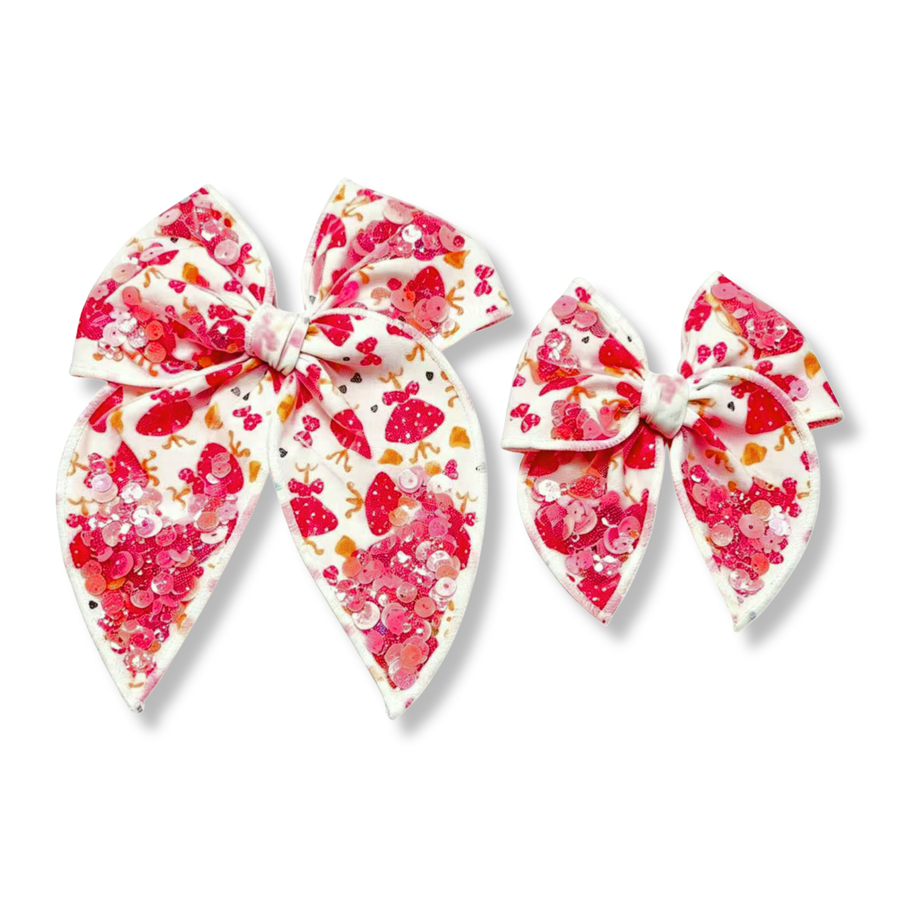 These eye-catching boutique bows feature a white ribbon printed with red polka-dot dresses, bows, hearts, and coordinating character-inspired accents. Sparkling sequin clusters are incorporated into the loops and tails, adding shimmer, texture, and dimension throughout the design. The classic bow shape and playful sparkle create a charming accessory perfect for themed outfits, special occasions, or everyday wear.
you choose size 
Small 4.5" x 4.5"
Large 6.5" x 6.5"