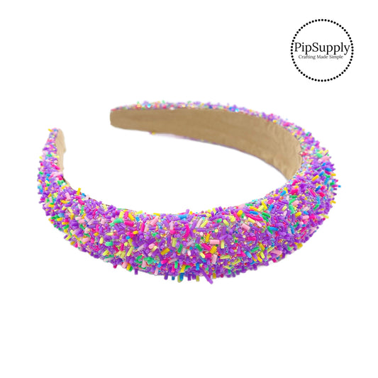 These purple glitter headbands are a stylish hair accessory and have the on and off ease of a headband. These spring party themed headbands are a perfect simple and fashionable answer to keeping your hair back! The headbands feature glitter and bright sprinkle mix.