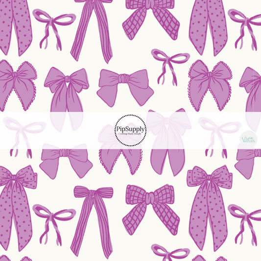 Purple Ribbons and Bows on Cream Fabric by the Yard.