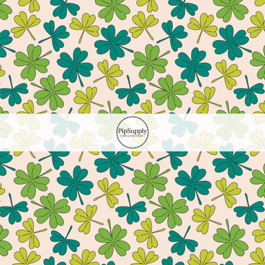 Scattered Multi-Green Clovers on Cream Fabric by the Yard.