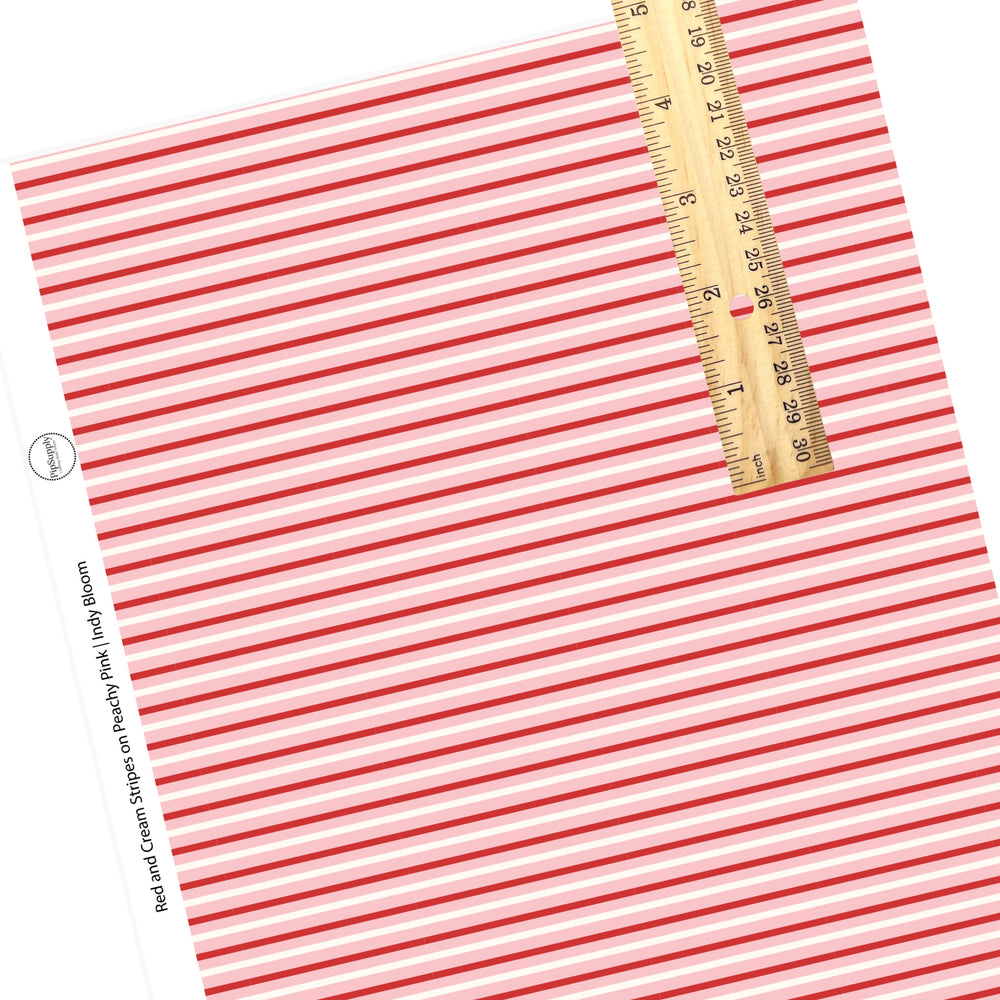 These Valentine's pattern themed faux leather sheets contain the following design elements: rows of cream and red strips on peachy pink. Our CPSIA compliant faux leather sheets or rolls can be used for all types of crafting projects.