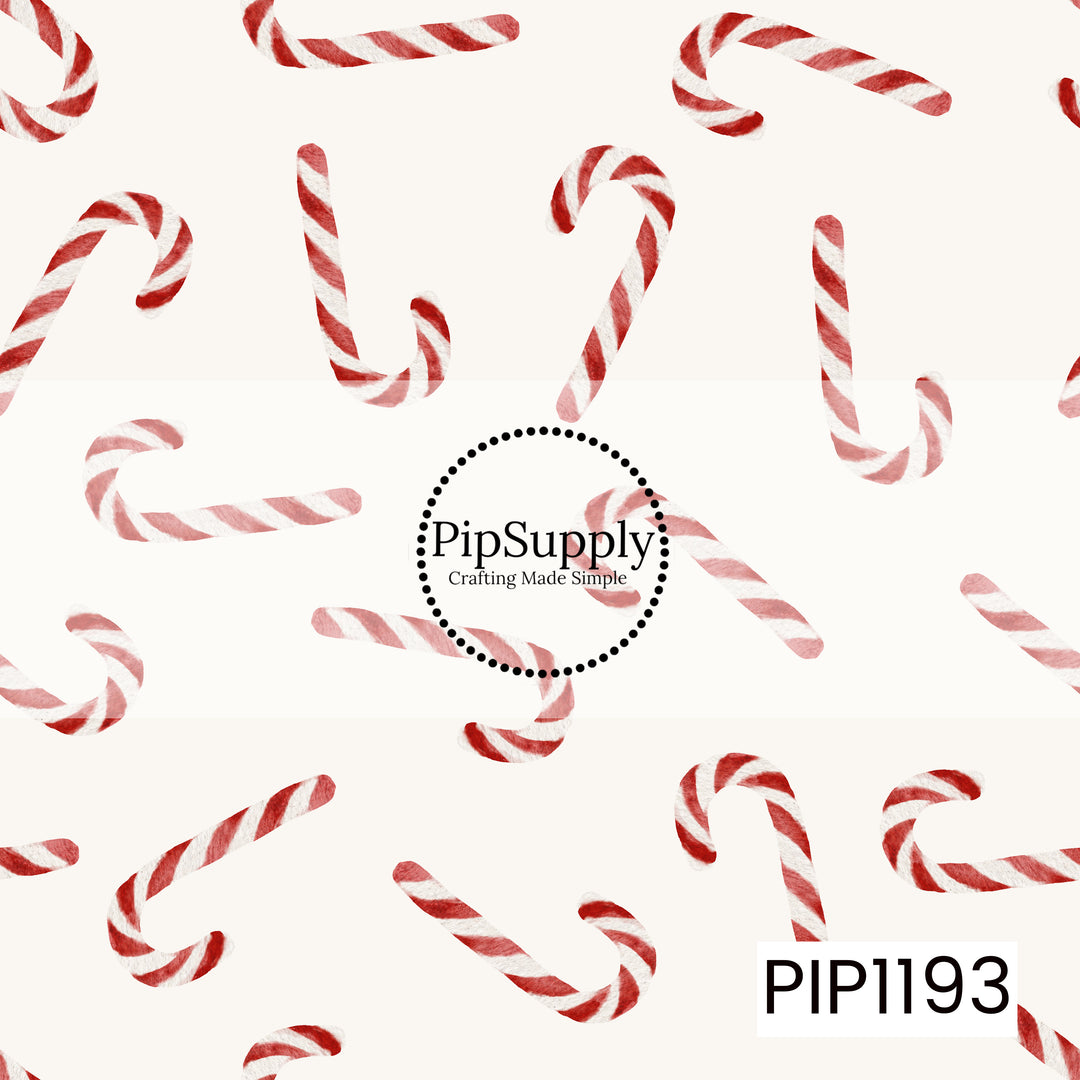 A simple watercolor Christmas pattern featuring classic red and white striped candy canes scattered in different directions across a soft cream background. The hand-painted texture gives the design a sweet, vintage-inspired holiday feel.
