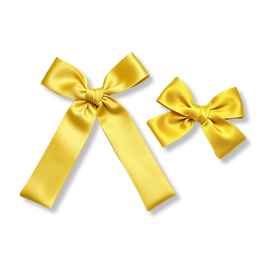 This classic satin bow is crafted from smooth, silky yellow ribbon with a soft sheen that catches the light beautifully. The bow features neatly shaped loops and a wrapped center knot for a polished, timeless look. Available in both a larger style with long flowing tails and a smaller matching style, this elegant bow adds a bright pop of color and a touch of sophistication to any outfit. 
choose size
Small Bow Sizing 4.5" x 4.5"
Large Bow Sizing 5.5" x 7"