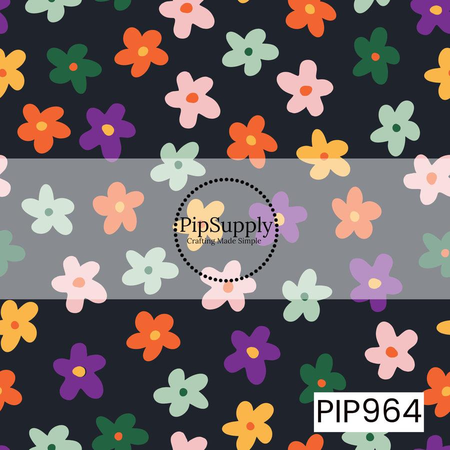 A playful scatter of retro-style flowers in shades of orange, purple, mustard yellow, blush pink, sage green, and dark green on a deep charcoal black background. The simple, bold floral shapes create a fun vintage-inspired Halloween look with a modern twist.
