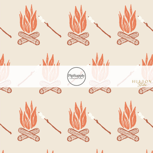 These fall themed fabric by the yard features roasting marshmallows over the campfire on cream. This fun autumn themed fabric can be used for all your sewing and crafting needs! 