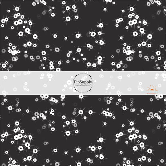 Black fabric by the yard with white scattered sequins.