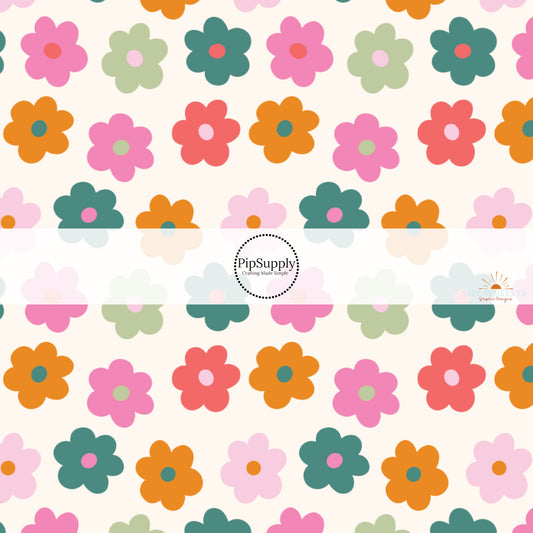 Cream fabric by the yard with pink, green, and orange retro florals.