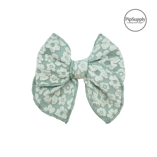 These floral pattern tulle bow strips are ready to package and resell to your customers no sewing or measuring necessary! These come pre-tied, just attach to a clip or headband. The floral pattern appears on both sides of the bow strip. 