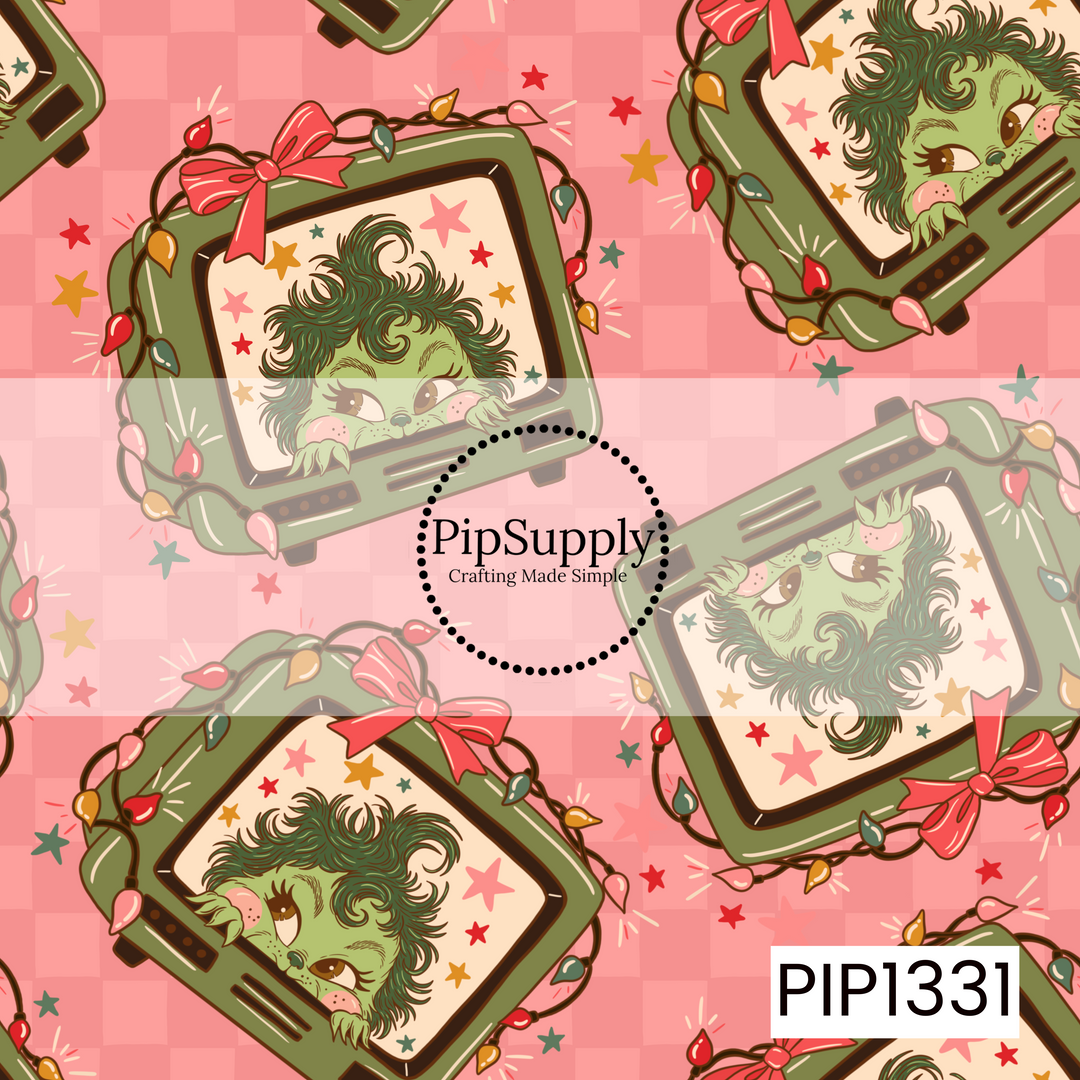 A whimsical retro Christmas pattern featuring a mischievous green holiday character peeking out from vintage olive green televisions. Each TV is wrapped in colorful Christmas lights and topped with oversized red and pink bows, surrounded by scattered retro stars in red, pink, mustard, and green. The illustrations are layered over a tonal pink checkerboard background for a playful, nostalgic holiday look.