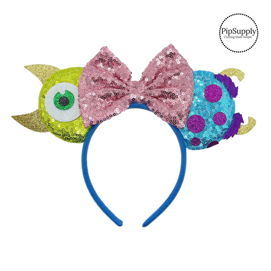 These blue and green mouse ear headbands are a stylish hair accessory. These comfortable headbands have an attached pink glitter bow and glitter mouse ears. Along with monster embellishments. This hair accessory comes completely assembled and is great for park vacations, costumes or for everyday wear!