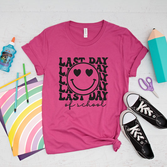 Iron on heat transfer with a heart eye smiley face an the phrase "Last day of school".