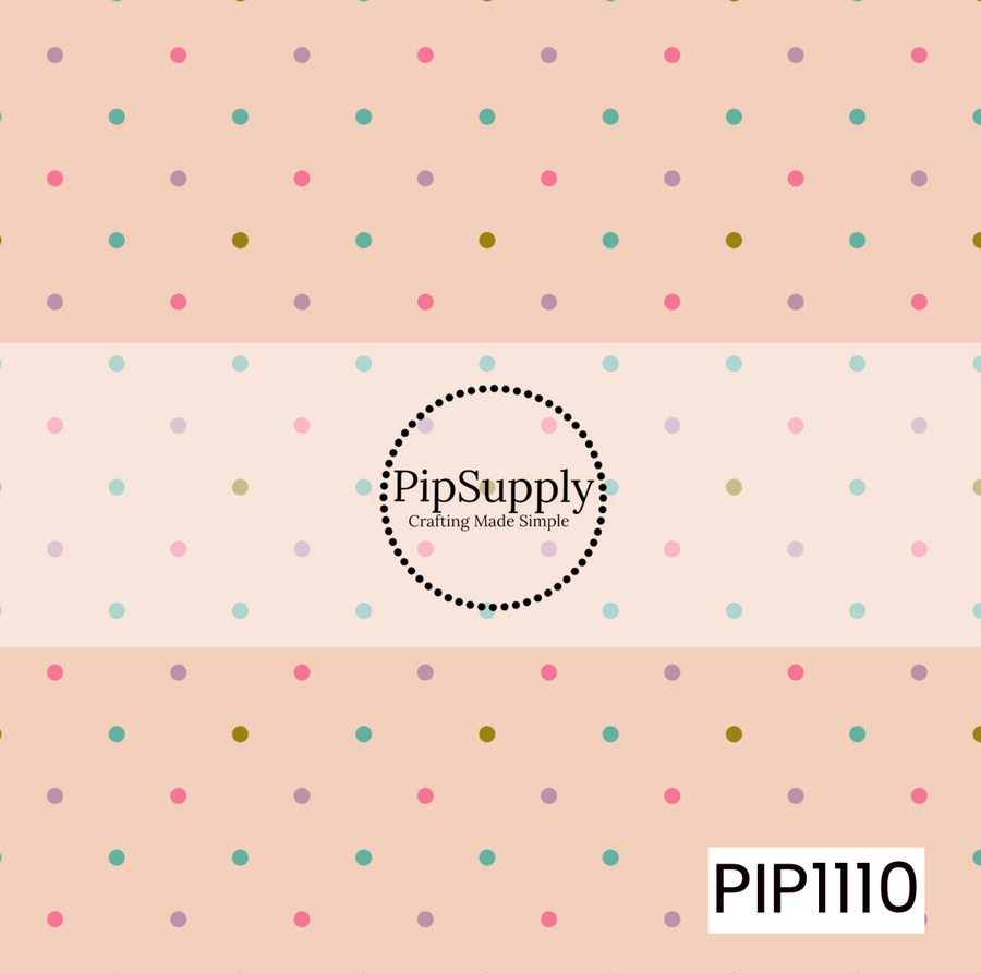 A soft peach background with scattered pastel polka dots in teal, pink, lavender, and mustard creates a sweet, playful coordinate.