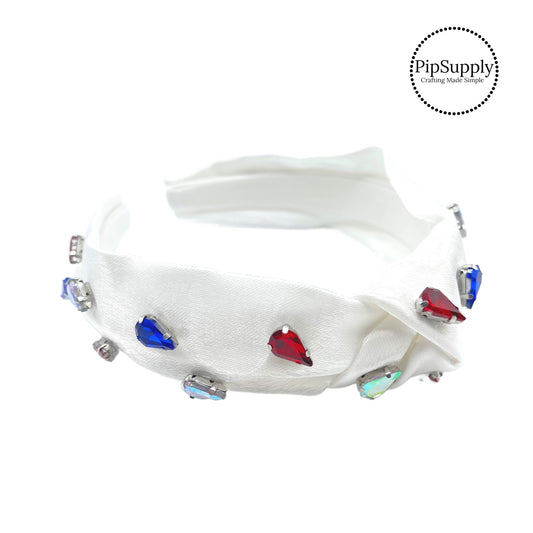 These summer headbands with patriotic colored rhinestones are a stylish hair accessory having the look of a knotted headwrap and the on and off ease of a headband. Made with thick high quality fabric these headbands are a perfect simple and fashionable answer to keeping your hair back!