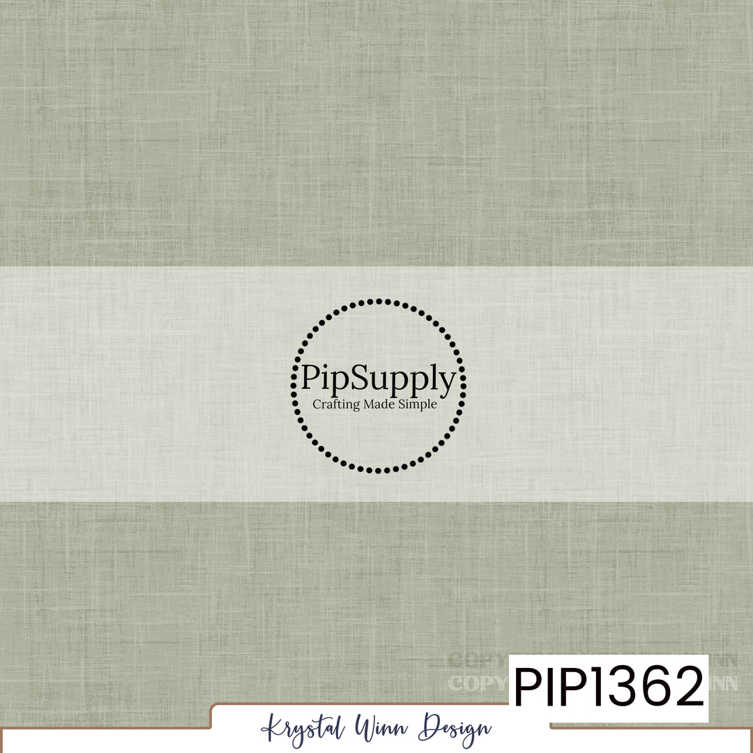 A soft, muted sage green solid background featuring a delicate woven linen texture with fine crosshatched fibers and subtle tonal variations, creating a natural, slightly weathered fabric-inspired appearance.