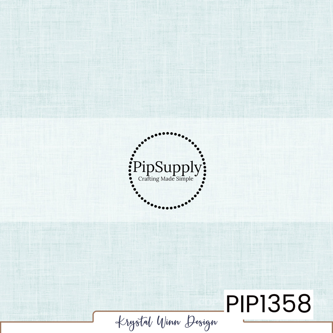 A soft, pale icy blue solid background featuring a subtle woven linen texture with delicate crosshatched fibers and faint variations in color, creating a light, airy, fabric-inspired appearance.