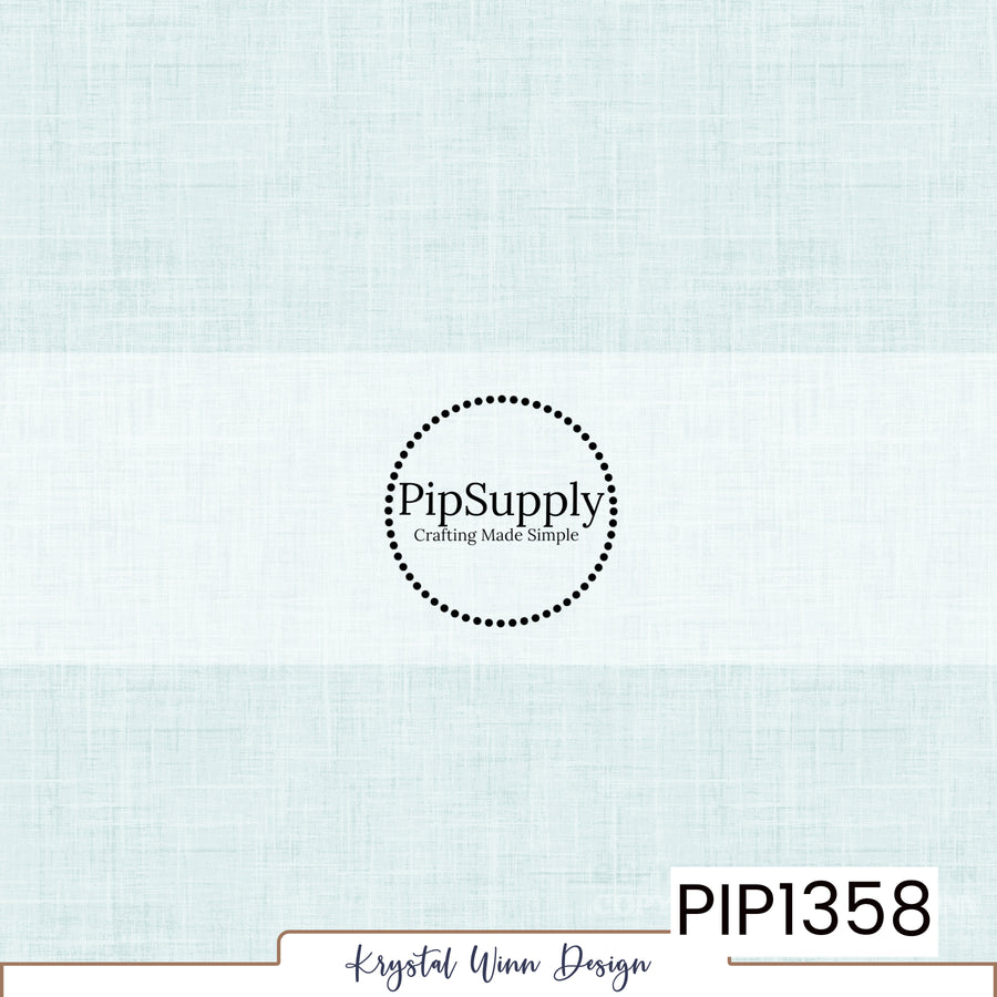 A soft, pale icy blue solid background featuring a subtle woven linen texture with delicate crosshatched fibers and faint variations in color, creating a light, airy, fabric-inspired appearance.