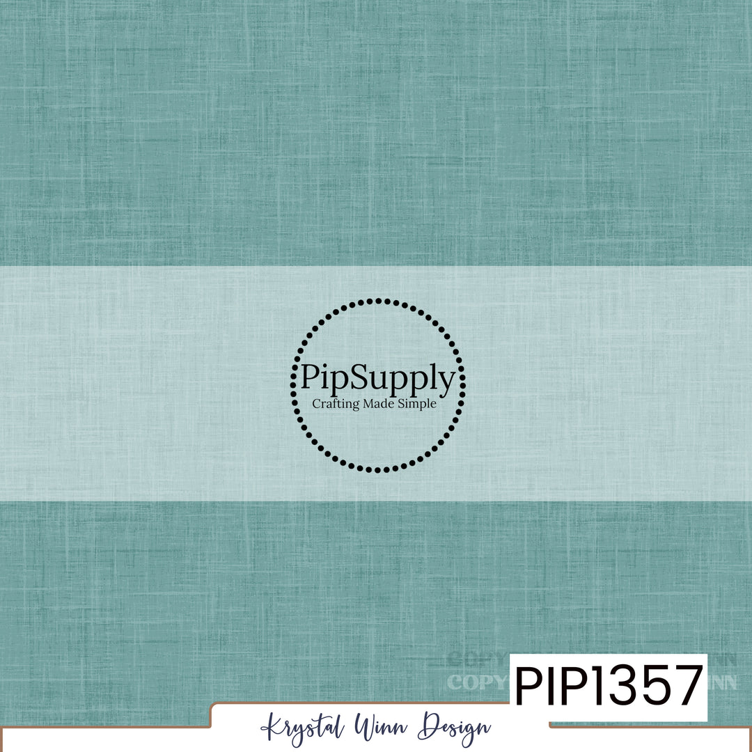 A soft, muted teal blue solid background featuring a delicate woven linen texture with fine crosshatched fibers and subtle tonal variations, creating a slightly weathered, fabric-inspired appearance.