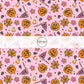 Pink fabric by the yard with pumpkins, florals, spiderwebs, and candy corn.
