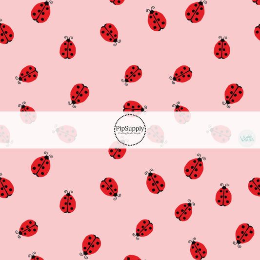 These ladybug themed pink fabric by the yard features tiny red ladybugs on light pink. This fun insect themed fabric can be used for all your sewing and crafting needs! 