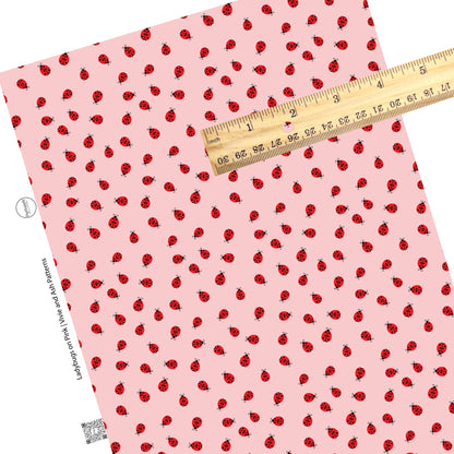 These ladybug themed pink faux leather sheets contain the following design elements: tiny red ladybugs on light pink. Our CPSIA compliant faux leather sheets or rolls can be used for all types of crafting projects.