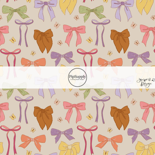 Muted Bows and Butterflies on Light Brown Fabric by the Yard.
