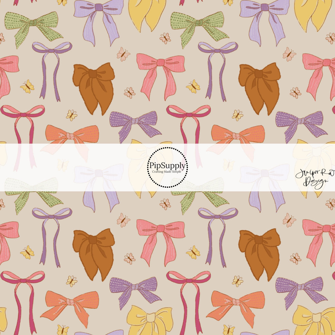 Muted Bows and Butterflies on Light Brown Fabric by the Yard.