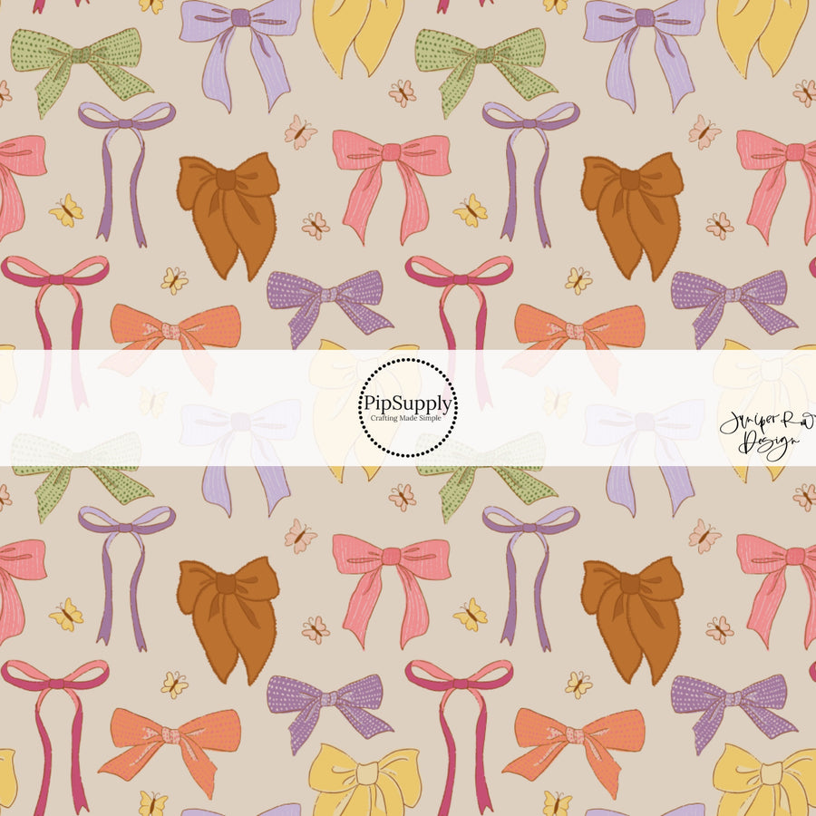 Muted Bows and Butterflies on Light Brown Fabric by the Yard.