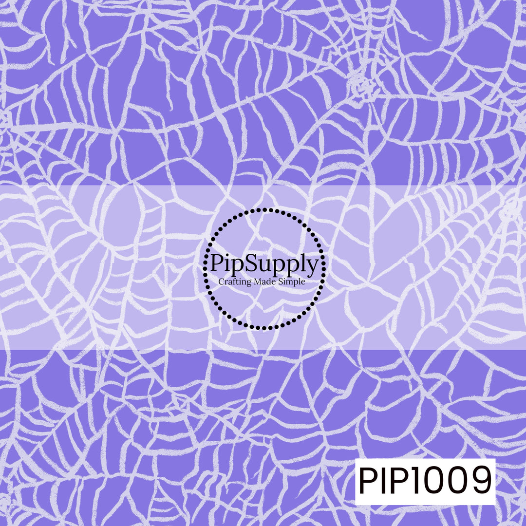 A whimsical Halloween seamless pattern featuring an allover arrangement of hand-drawn spider webs in soft white with a distressed, chalk-like texture. Set against a rich periwinkle purple background, the overlapping webs create a playful spooky look with a vintage, hand-sketched feel, making it a perfect coordinating design for retro Halloween collections.
