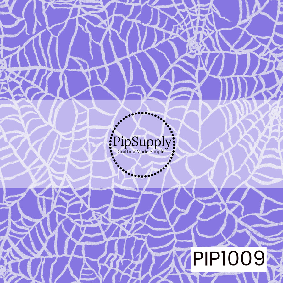 A whimsical Halloween seamless pattern featuring an allover arrangement of hand-drawn spider webs in soft white with a distressed, chalk-like texture. Set against a rich periwinkle purple background, the overlapping webs create a playful spooky look with a vintage, hand-sketched feel, making it a perfect coordinating design for retro Halloween collections.
