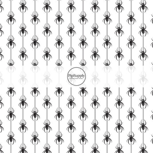 Black spiders in vertical rows on white fabric by the yard.