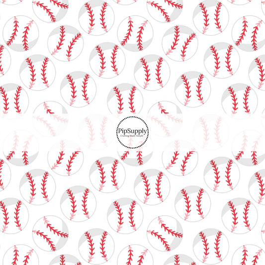 White and red baseballs on white fabric by the yard.
