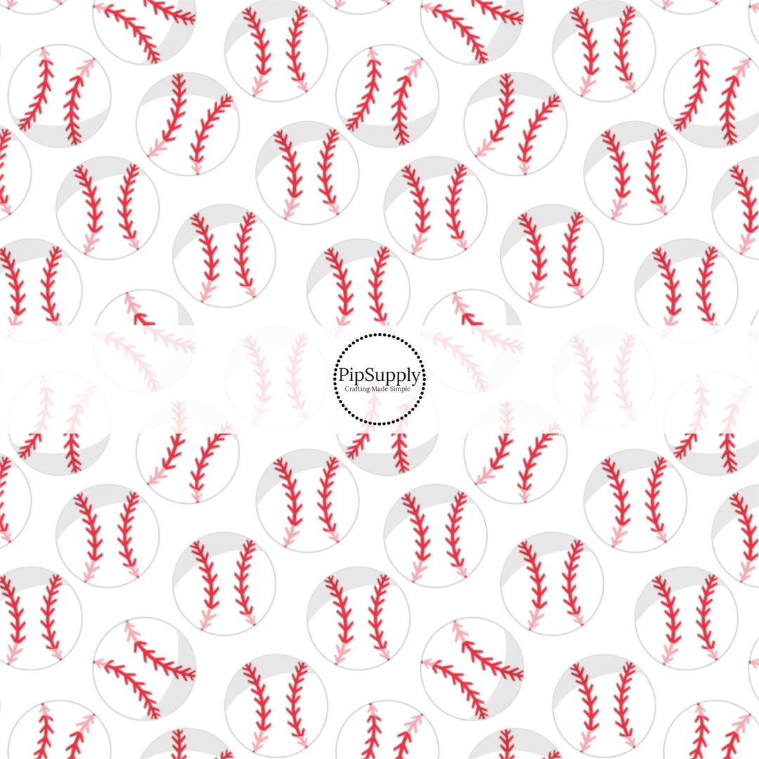 White and red baseballs on white fabric by the yard.