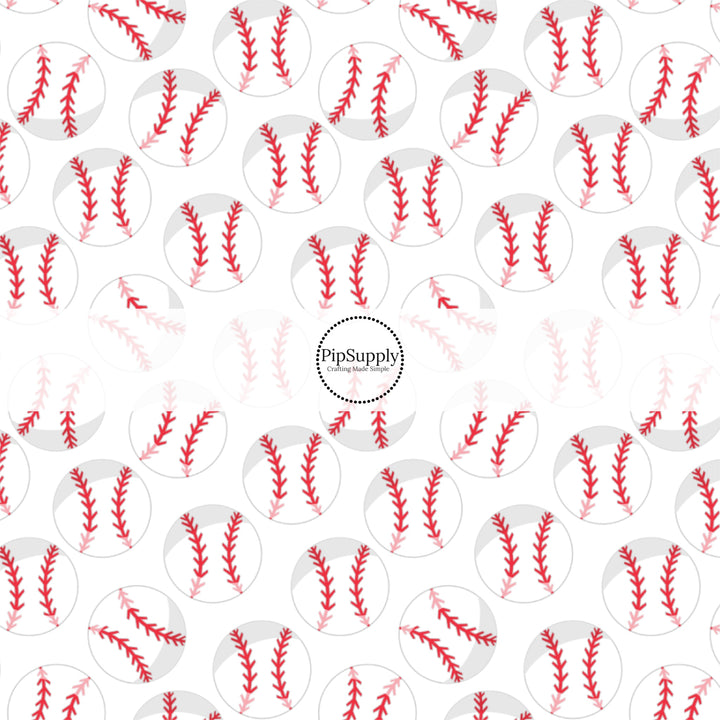 White and red baseballs on white fabric by the yard.