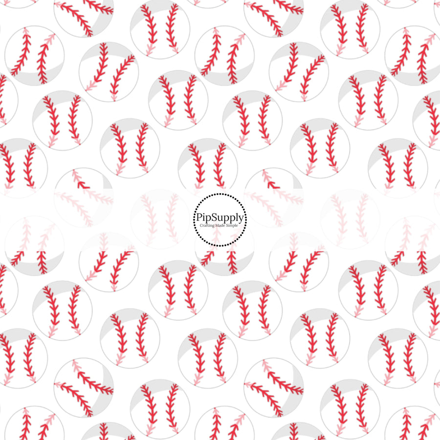 White and red baseballs on white fabric by the yard.